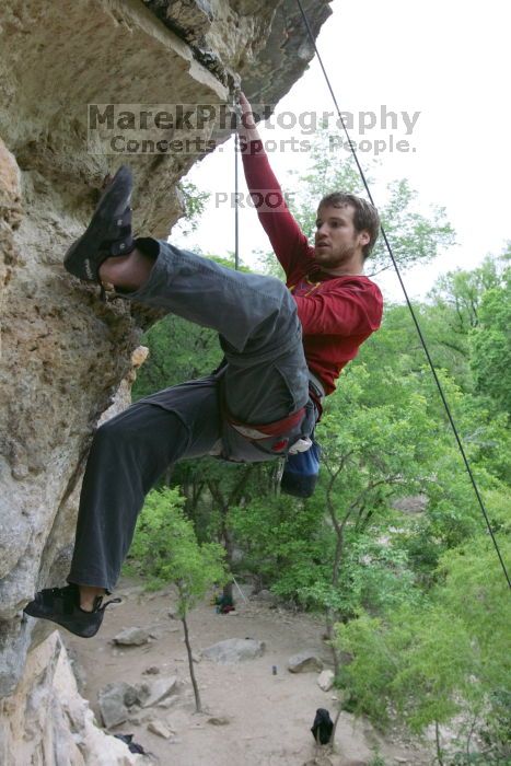 Me top rope climbing Diving for Rocks (5.10d), photographed from  the third bolt of Magster (5.10a) by Andrew Dreher.  It was another long day of rock climbing at Seismic Wall on Austin's Barton Creek Greenbelt, Saturday, April 11, 2009.

Filename: SRM_20090411_17180175.JPG
Aperture: f/5.6
Shutter Speed: 1/320
Body: Canon EOS-1D Mark II
Lens: Canon EF 16-35mm f/2.8 L