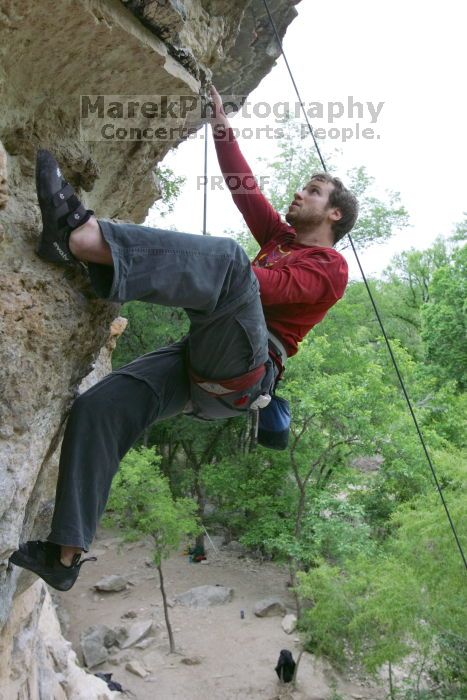 Me top rope climbing Diving for Rocks (5.10d), photographed from  the third bolt of Magster (5.10a) by Andrew Dreher.  It was another long day of rock climbing at Seismic Wall on Austin's Barton Creek Greenbelt, Saturday, April 11, 2009.

Filename: SRM_20090411_17180276.JPG
Aperture: f/5.6
Shutter Speed: 1/320
Body: Canon EOS-1D Mark II
Lens: Canon EF 16-35mm f/2.8 L