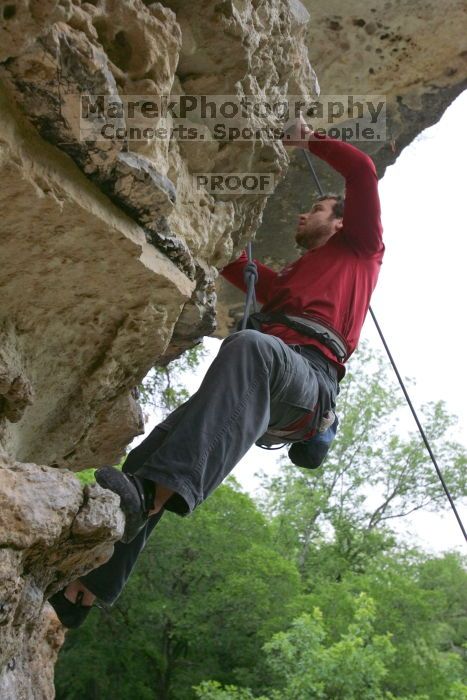 Me top rope climbing Diving for Rocks (5.10d), photographed from  the third bolt of Magster (5.10a) by Andrew Dreher.  It was another long day of rock climbing at Seismic Wall on Austin's Barton Creek Greenbelt, Saturday, April 11, 2009.

Filename: SRM_20090411_17200884.JPG
Aperture: f/5.6
Shutter Speed: 1/320
Body: Canon EOS-1D Mark II
Lens: Canon EF 16-35mm f/2.8 L