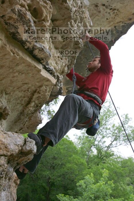 Me top rope climbing Diving for Rocks (5.10d), photographed from  the third bolt of Magster (5.10a) by Andrew Dreher.  It was another long day of rock climbing at Seismic Wall on Austin's Barton Creek Greenbelt, Saturday, April 11, 2009.

Filename: SRM_20090411_17200885.JPG
Aperture: f/5.6
Shutter Speed: 1/320
Body: Canon EOS-1D Mark II
Lens: Canon EF 16-35mm f/2.8 L