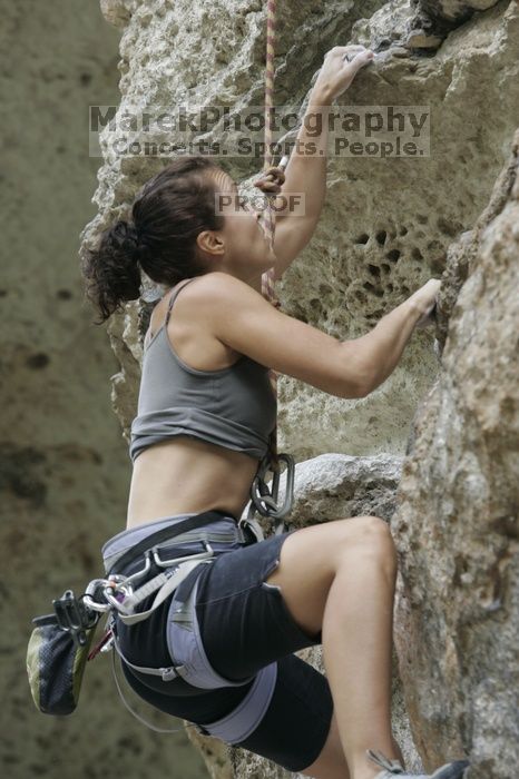 Britta Kakacek, winner of the speed competition with a time of 39.08 seconds.  CTM hosted a speed climbing event at Seismic Wall on Diving for Rocks to benefit the Austin Area Food Bank, Saturday, May 9, 2009.

Filename: SRM_20090509_10360318.jpg
Aperture: f/5.6
Shutter Speed: 1/200
Body: Canon EOS-1D Mark II
Lens: Canon EF 80-200mm f/2.8 L