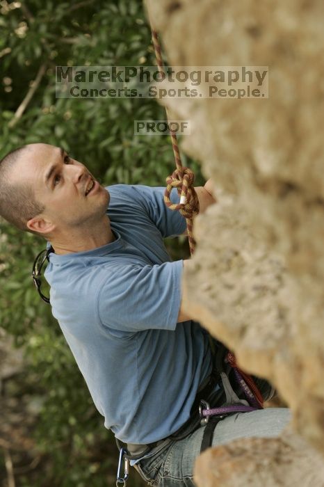 Sean O'Grady climbs in just running shoes.  CTM hosted a speed climbing event at Seismic Wall on Diving for Rocks to benefit the Austin Area Food Bank, Saturday, May 9, 2009.

Filename: SRM_20090509_11315298.jpg
Aperture: f/5.6
Shutter Speed: 1/400
Body: Canon EOS-1D Mark II
Lens: Canon EF 80-200mm f/2.8 L