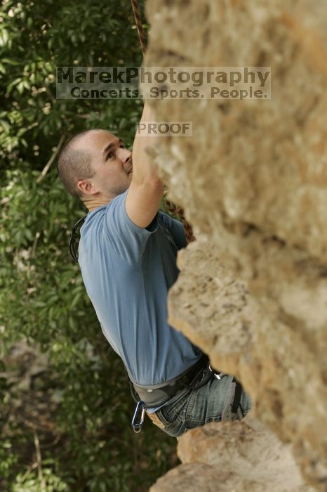 Sean O'Grady climbs in just running shoes.  CTM hosted a speed climbing event at Seismic Wall on Diving for Rocks to benefit the Austin Area Food Bank, Saturday, May 9, 2009.

Filename: SRM_20090509_11315299.jpg
Aperture: f/5.6
Shutter Speed: 1/500
Body: Canon EOS-1D Mark II
Lens: Canon EF 80-200mm f/2.8 L