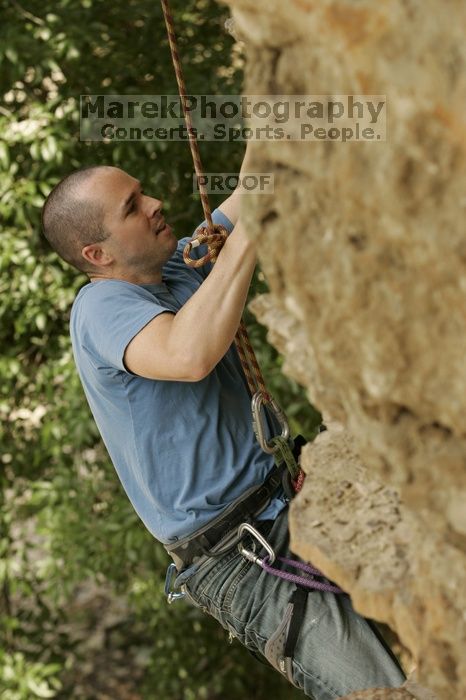 Sean O'Grady climbs in just running shoes.  CTM hosted a speed climbing event at Seismic Wall on Diving for Rocks to benefit the Austin Area Food Bank, Saturday, May 9, 2009.

Filename: SRM_20090509_11315505.jpg
Aperture: f/5.6
Shutter Speed: 1/500
Body: Canon EOS-1D Mark II
Lens: Canon EF 80-200mm f/2.8 L