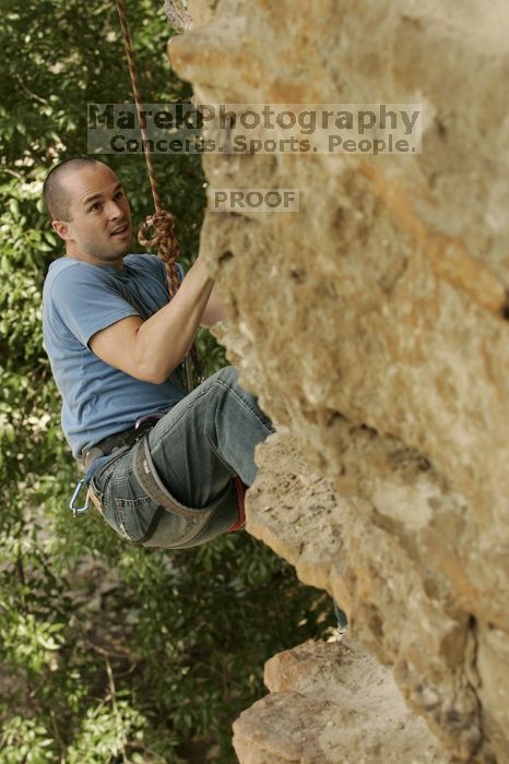 Sean O'Grady climbs in just running shoes.  CTM hosted a speed climbing event at Seismic Wall on Diving for Rocks to benefit the Austin Area Food Bank, Saturday, May 9, 2009.

Filename: SRM_20090509_11315607.jpg
Aperture: f/5.6
Shutter Speed: 1/500
Body: Canon EOS-1D Mark II
Lens: Canon EF 80-200mm f/2.8 L