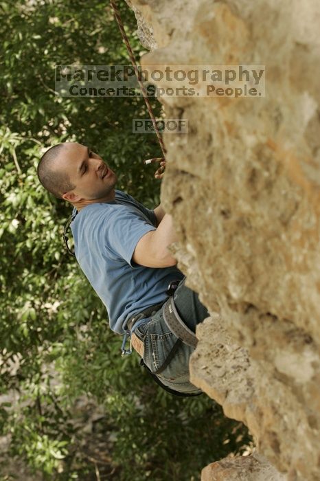 Sean O'Grady climbs in just running shoes.  CTM hosted a speed climbing event at Seismic Wall on Diving for Rocks to benefit the Austin Area Food Bank, Saturday, May 9, 2009.

Filename: SRM_20090509_11315709.jpg
Aperture: f/5.6
Shutter Speed: 1/500
Body: Canon EOS-1D Mark II
Lens: Canon EF 80-200mm f/2.8 L