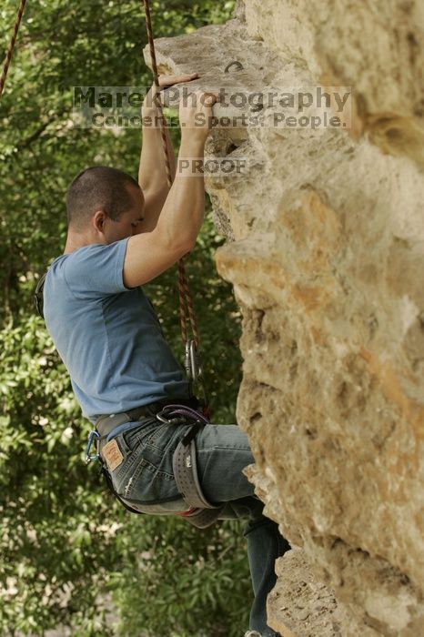 Sean O'Grady climbs in just running shoes.  CTM hosted a speed climbing event at Seismic Wall on Diving for Rocks to benefit the Austin Area Food Bank, Saturday, May 9, 2009.

Filename: SRM_20090509_11320014.jpg
Aperture: f/5.6
Shutter Speed: 1/500
Body: Canon EOS-1D Mark II
Lens: Canon EF 80-200mm f/2.8 L