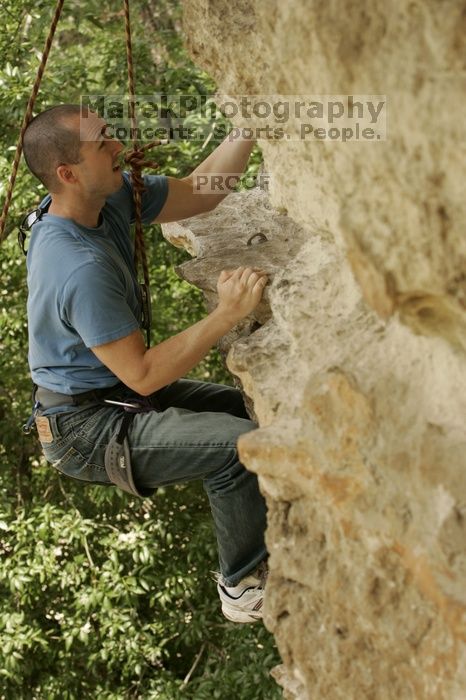 Sean O'Grady climbs in just running shoes.  CTM hosted a speed climbing event at Seismic Wall on Diving for Rocks to benefit the Austin Area Food Bank, Saturday, May 9, 2009.

Filename: SRM_20090509_11320523.jpg
Aperture: f/5.6
Shutter Speed: 1/500
Body: Canon EOS-1D Mark II
Lens: Canon EF 80-200mm f/2.8 L