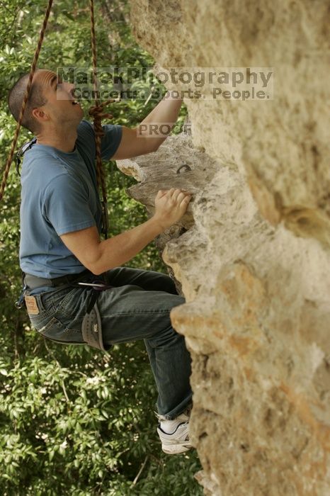 Sean O'Grady climbs in just running shoes.  CTM hosted a speed climbing event at Seismic Wall on Diving for Rocks to benefit the Austin Area Food Bank, Saturday, May 9, 2009.

Filename: SRM_20090509_11320524.jpg
Aperture: f/5.6
Shutter Speed: 1/500
Body: Canon EOS-1D Mark II
Lens: Canon EF 80-200mm f/2.8 L