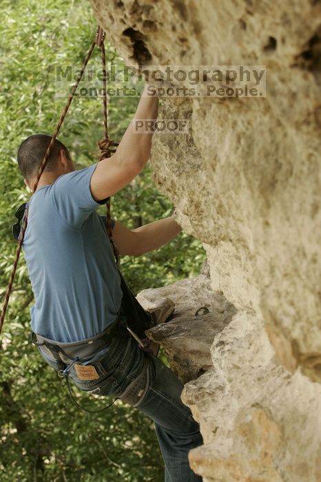 Sean O'Grady climbs in just running shoes.  CTM hosted a speed climbing event at Seismic Wall on Diving for Rocks to benefit the Austin Area Food Bank, Saturday, May 9, 2009.

Filename: SRM_20090509_11320727.jpg
Aperture: f/5.6
Shutter Speed: 1/400
Body: Canon EOS-1D Mark II
Lens: Canon EF 80-200mm f/2.8 L