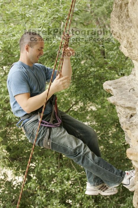 Sean O'Grady climbs in just running shoes.  CTM hosted a speed climbing event at Seismic Wall on Diving for Rocks to benefit the Austin Area Food Bank, Saturday, May 9, 2009.

Filename: SRM_20090509_11321133.jpg
Aperture: f/5.6
Shutter Speed: 1/200
Body: Canon EOS-1D Mark II
Lens: Canon EF 80-200mm f/2.8 L