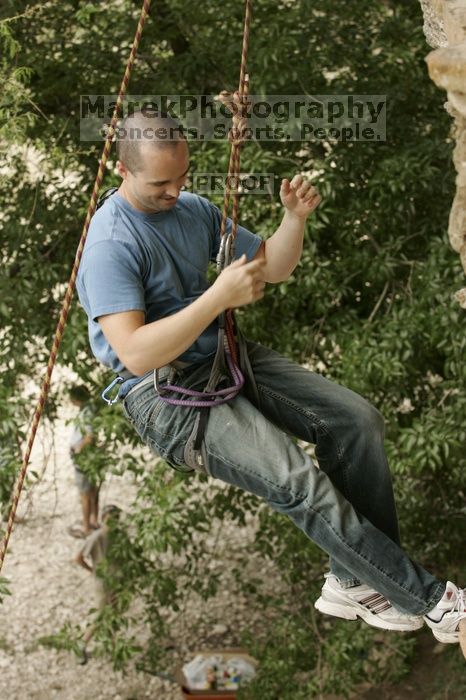 Sean O'Grady climbs in just running shoes.  CTM hosted a speed climbing event at Seismic Wall on Diving for Rocks to benefit the Austin Area Food Bank, Saturday, May 9, 2009.

Filename: SRM_20090509_11321335.jpg
Aperture: f/5.6
Shutter Speed: 1/320
Body: Canon EOS-1D Mark II
Lens: Canon EF 80-200mm f/2.8 L