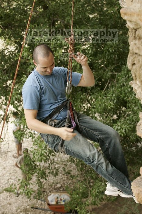 Sean O'Grady climbs in just running shoes.  CTM hosted a speed climbing event at Seismic Wall on Diving for Rocks to benefit the Austin Area Food Bank, Saturday, May 9, 2009.

Filename: SRM_20090509_11321336.jpg
Aperture: f/5.6
Shutter Speed: 1/320
Body: Canon EOS-1D Mark II
Lens: Canon EF 80-200mm f/2.8 L