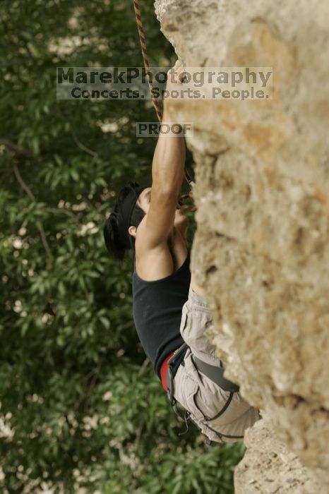 Long Ta, winner of the speed competition with a time of 15.33 seconds.  CTM hosted a speed climbing event at Seismic Wall on Diving for Rocks to benefit the Austin Area Food Bank, Saturday, May 9, 2009.

Filename: SRM_20090509_11333045.jpg
Aperture: f/5.6
Shutter Speed: 1/320
Body: Canon EOS-1D Mark II
Lens: Canon EF 80-200mm f/2.8 L