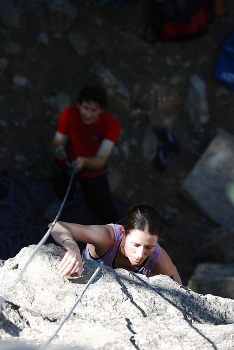 Beth Marek top rope climbing Roo Dog (5.8) with Andrew Dreher belaying, taken from the anchors of the route.  It was Beth's third time outside, and another long day of rock climbing at Seismic Wall on Austin's Barton Creek Greenbelt, Monday, May 25, 2009.

Filename: SRM_20090525_09415296.JPG
Aperture: f/4.0
Shutter Speed: 1/640
Body: Canon EOS-1D Mark II
Lens: Canon EF 80-200mm f/2.8 L