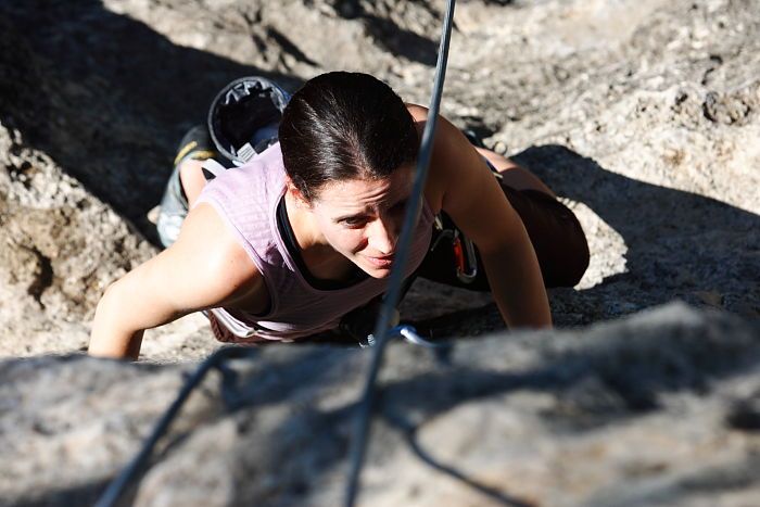 Beth Marek top rope climbing Roo Dog (5.8), taken from the anchors of the route.  It was Beth's third time outside, and another long day of rock climbing at Seismic Wall on Austin's Barton Creek Greenbelt, Monday, May 25, 2009.

Filename: SRM_20090525_09440615.JPG
Aperture: f/5.6
Shutter Speed: 1/1250
Body: Canon EOS-1D Mark II
Lens: Canon EF 80-200mm f/2.8 L