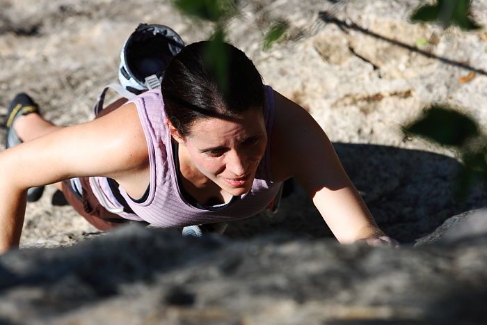 Beth Marek top rope climbing Roo Dog (5.8), taken from the anchors of the route.  It was Beth's third time outside, and another long day of rock climbing at Seismic Wall on Austin's Barton Creek Greenbelt, Monday, May 25, 2009.

Filename: SRM_20090525_09441919.JPG
Aperture: f/5.6
Shutter Speed: 1/1600
Body: Canon EOS-1D Mark II
Lens: Canon EF 80-200mm f/2.8 L