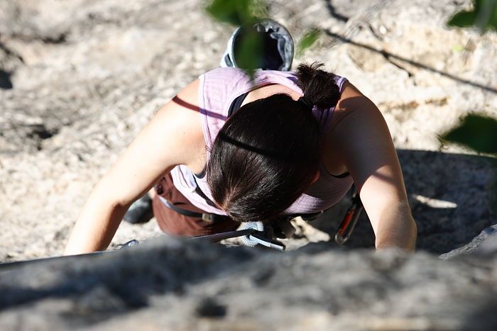 Beth Marek top rope climbing Roo Dog (5.8), taken from the anchors of the route.  It was Beth's third time outside, and another long day of rock climbing at Seismic Wall on Austin's Barton Creek Greenbelt, Monday, May 25, 2009.

Filename: SRM_20090525_09442020.JPG
Aperture: f/5.6
Shutter Speed: 1/1000
Body: Canon EOS-1D Mark II
Lens: Canon EF 80-200mm f/2.8 L