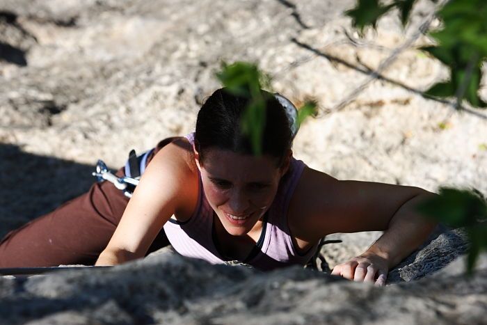 Beth Marek top rope climbing Roo Dog (5.8), taken from the anchors of the route.  It was Beth's third time outside, and another long day of rock climbing at Seismic Wall on Austin's Barton Creek Greenbelt, Monday, May 25, 2009.

Filename: SRM_20090525_09445325.JPG
Aperture: f/5.6
Shutter Speed: 1/1250
Body: Canon EOS-1D Mark II
Lens: Canon EF 80-200mm f/2.8 L