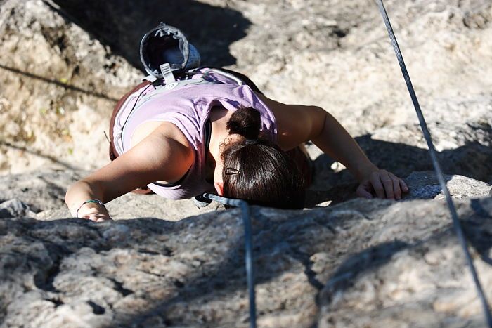 Beth Marek top rope climbing Roo Dog (5.8), taken from the anchors of the route.  It was Beth's third time outside, and another long day of rock climbing at Seismic Wall on Austin's Barton Creek Greenbelt, Monday, May 25, 2009.

Filename: SRM_20090525_09485131.JPG
Aperture: f/5.0
Shutter Speed: 1/1600
Body: Canon EOS-1D Mark II
Lens: Canon EF 80-200mm f/2.8 L