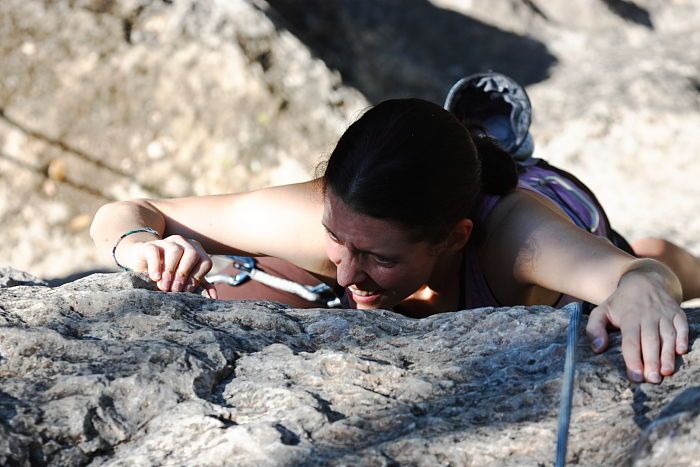 Beth Marek top rope climbing Roo Dog (5.8), taken from the anchors of the route.  It was Beth's third time outside, and another long day of rock climbing at Seismic Wall on Austin's Barton Creek Greenbelt, Monday, May 25, 2009.

Filename: SRM_20090525_09494345.JPG
Aperture: f/5.0
Shutter Speed: 1/1250
Body: Canon EOS-1D Mark II
Lens: Canon EF 80-200mm f/2.8 L