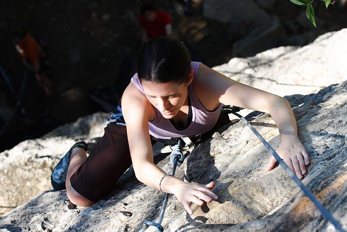 Beth Marek top rope climbing Roo Dog (5.8), taken from the anchors of the route.  It was Beth's third time outside, and another long day of rock climbing at Seismic Wall on Austin's Barton Creek Greenbelt, Monday, May 25, 2009.

Filename: SRM_20090525_09520295.JPG
Aperture: f/5.6
Shutter Speed: 1/500
Body: Canon EOS-1D Mark II
Lens: Canon EF 80-200mm f/2.8 L