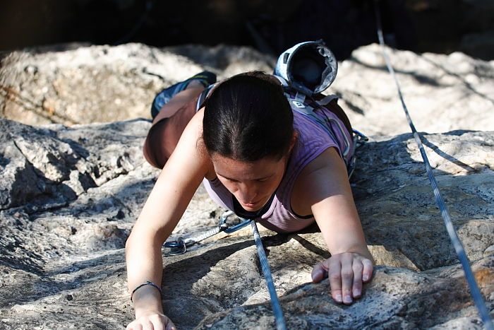 Beth Marek top rope climbing Roo Dog (5.8), taken from the anchors of the route.  It was Beth's third time outside, and another long day of rock climbing at Seismic Wall on Austin's Barton Creek Greenbelt, Monday, May 25, 2009.

Filename: SRM_20090525_09522098.JPG
Aperture: f/5.6
Shutter Speed: 1/500
Body: Canon EOS-1D Mark II
Lens: Canon EF 80-200mm f/2.8 L