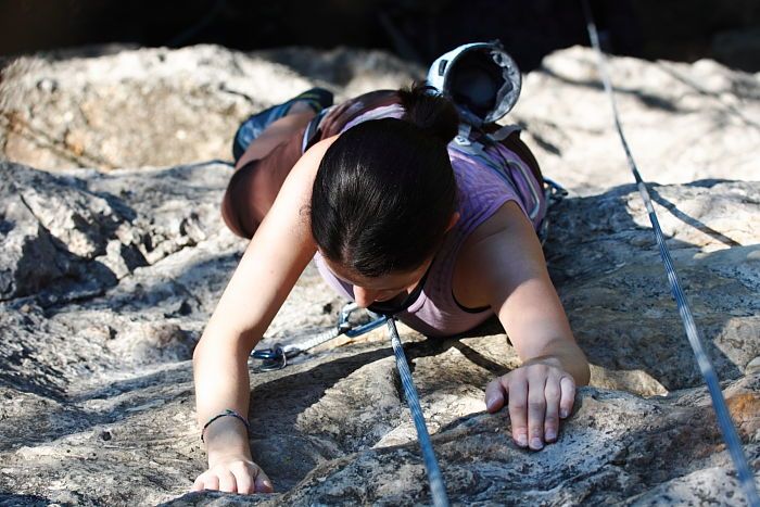 Beth Marek top rope climbing Roo Dog (5.8), taken from the anchors of the route.  It was Beth's third time outside, and another long day of rock climbing at Seismic Wall on Austin's Barton Creek Greenbelt, Monday, May 25, 2009.

Filename: SRM_20090525_09522099.JPG
Aperture: f/5.6
Shutter Speed: 1/500
Body: Canon EOS-1D Mark II
Lens: Canon EF 80-200mm f/2.8 L