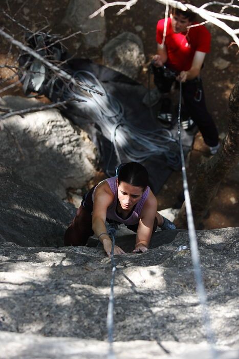 Beth Marek top rope climbing Hollywood (5.7) with Andrew Dreher belaying, taken from the anchors of the route.  It was Beth's third time outside, and another long day of rock climbing at Seismic Wall on Austin's Barton Creek Greenbelt, Monday, May 25, 2009.

Filename: SRM_20090525_10381012.JPG
Aperture: f/4.0
Shutter Speed: 1/800
Body: Canon EOS-1D Mark II
Lens: Canon EF 80-200mm f/2.8 L