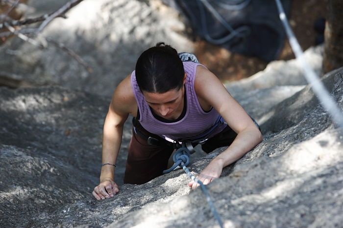 Beth Marek top rope climbing Hollywood (5.7), taken from the anchors of the route.  It was Beth's third time outside, and another long day of rock climbing at Seismic Wall on Austin's Barton Creek Greenbelt, Monday, May 25, 2009.

Filename: SRM_20090525_10382714.JPG
Aperture: f/4.0
Shutter Speed: 1/400
Body: Canon EOS-1D Mark II
Lens: Canon EF 80-200mm f/2.8 L