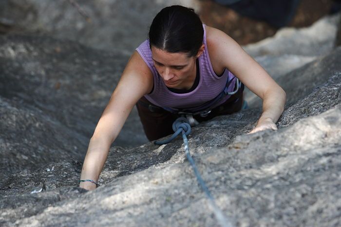 Beth Marek top rope climbing Hollywood (5.7), taken from the anchors of the route.  It was Beth's third time outside, and another long day of rock climbing at Seismic Wall on Austin's Barton Creek Greenbelt, Monday, May 25, 2009.

Filename: SRM_20090525_10383718.JPG
Aperture: f/4.0
Shutter Speed: 1/400
Body: Canon EOS-1D Mark II
Lens: Canon EF 80-200mm f/2.8 L