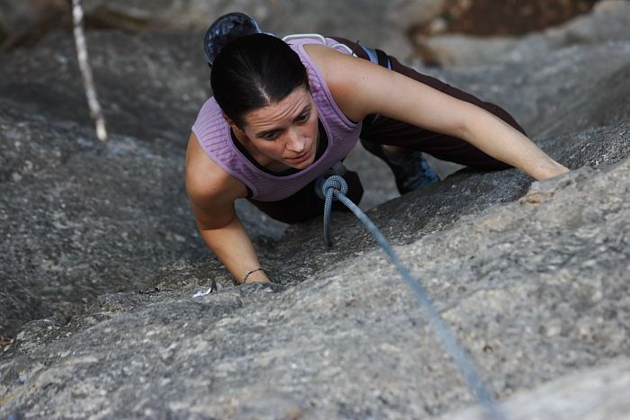 Beth Marek top rope climbing Hollywood (5.7), taken from the anchors of the route.  It was Beth's third time outside, and another long day of rock climbing at Seismic Wall on Austin's Barton Creek Greenbelt, Monday, May 25, 2009.

Filename: SRM_20090525_10385924.JPG
Aperture: f/4.0
Shutter Speed: 1/400
Body: Canon EOS-1D Mark II
Lens: Canon EF 80-200mm f/2.8 L