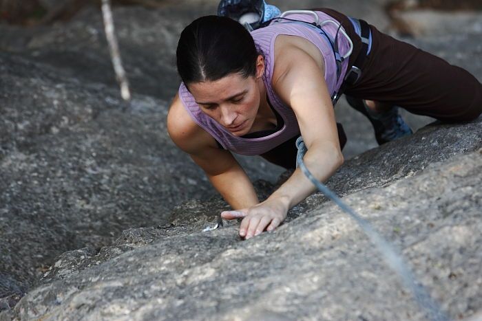 Beth Marek top rope climbing Hollywood (5.7), taken from the anchors of the route.  It was Beth's third time outside, and another long day of rock climbing at Seismic Wall on Austin's Barton Creek Greenbelt, Monday, May 25, 2009.

Filename: SRM_20090525_10390127.JPG
Aperture: f/4.0
Shutter Speed: 1/400
Body: Canon EOS-1D Mark II
Lens: Canon EF 80-200mm f/2.8 L