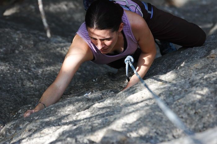 Beth Marek top rope climbing Hollywood (5.7), taken from the anchors of the route.  It was Beth's third time outside, and another long day of rock climbing at Seismic Wall on Austin's Barton Creek Greenbelt, Monday, May 25, 2009.

Filename: SRM_20090525_10390631.JPG
Aperture: f/4.0
Shutter Speed: 1/640
Body: Canon EOS-1D Mark II
Lens: Canon EF 80-200mm f/2.8 L