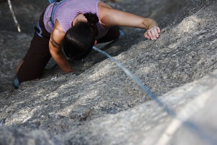 Beth Marek top rope climbing Hollywood (5.7), taken from the anchors of the route.  It was Beth's third time outside, and another long day of rock climbing at Seismic Wall on Austin's Barton Creek Greenbelt, Monday, May 25, 2009.

Filename: SRM_20090525_10391533.JPG
Aperture: f/4.0
Shutter Speed: 1/500
Body: Canon EOS-1D Mark II
Lens: Canon EF 80-200mm f/2.8 L