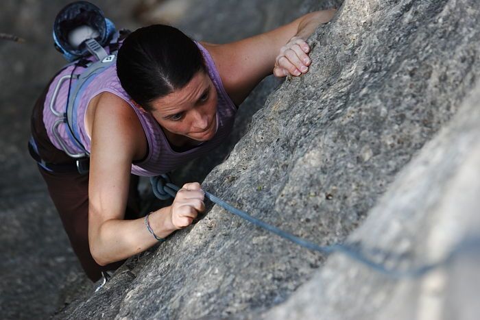 Beth Marek top rope climbing Hollywood (5.7), taken from the anchors of the route.  It was Beth's third time outside, and another long day of rock climbing at Seismic Wall on Austin's Barton Creek Greenbelt, Monday, May 25, 2009.

Filename: SRM_20090525_10392038.JPG
Aperture: f/4.0
Shutter Speed: 1/500
Body: Canon EOS-1D Mark II
Lens: Canon EF 80-200mm f/2.8 L