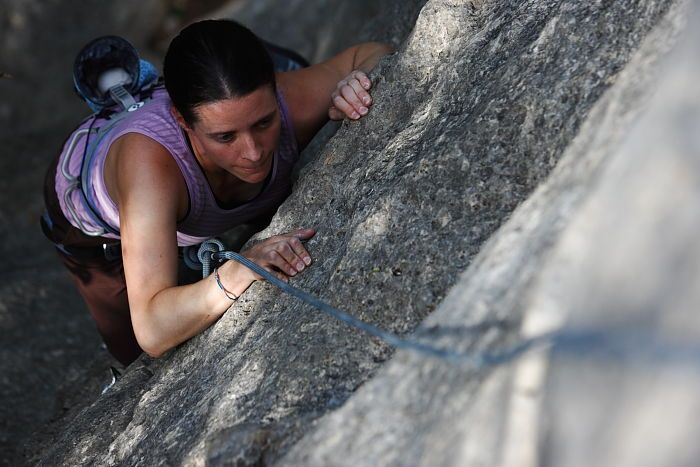 Beth Marek top rope climbing Hollywood (5.7), taken from the anchors of the route.  It was Beth's third time outside, and another long day of rock climbing at Seismic Wall on Austin's Barton Creek Greenbelt, Monday, May 25, 2009.

Filename: SRM_20090525_10392240.JPG
Aperture: f/4.0
Shutter Speed: 1/800
Body: Canon EOS-1D Mark II
Lens: Canon EF 80-200mm f/2.8 L