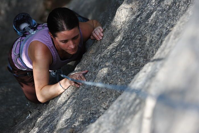 Beth Marek top rope climbing Hollywood (5.7), taken from the anchors of the route.  It was Beth's third time outside, and another long day of rock climbing at Seismic Wall on Austin's Barton Creek Greenbelt, Monday, May 25, 2009.

Filename: SRM_20090525_10392341.JPG
Aperture: f/4.0
Shutter Speed: 1/800
Body: Canon EOS-1D Mark II
Lens: Canon EF 80-200mm f/2.8 L