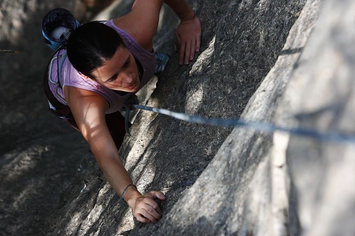 Beth Marek top rope climbing Hollywood (5.7), taken from the anchors of the route.  It was Beth's third time outside, and another long day of rock climbing at Seismic Wall on Austin's Barton Creek Greenbelt, Monday, May 25, 2009.

Filename: SRM_20090525_10393145.JPG
Aperture: f/5.6
Shutter Speed: 1/640
Body: Canon EOS-1D Mark II
Lens: Canon EF 80-200mm f/2.8 L