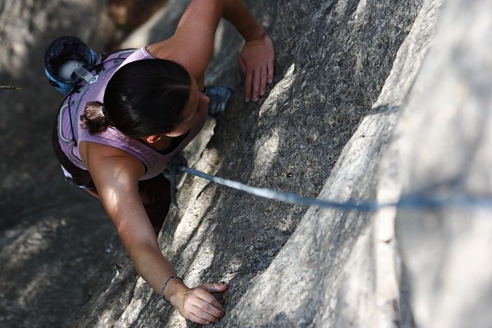 Beth Marek top rope climbing Hollywood (5.7), taken from the anchors of the route.  It was Beth's third time outside, and another long day of rock climbing at Seismic Wall on Austin's Barton Creek Greenbelt, Monday, May 25, 2009.

Filename: SRM_20090525_10393246.JPG
Aperture: f/5.6
Shutter Speed: 1/500
Body: Canon EOS-1D Mark II
Lens: Canon EF 80-200mm f/2.8 L