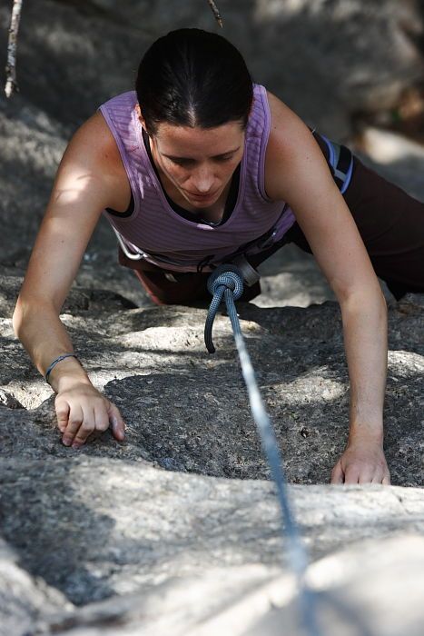 Beth Marek top rope climbing Hollywood (5.7), taken from the anchors of the route.  It was Beth's third time outside, and another long day of rock climbing at Seismic Wall on Austin's Barton Creek Greenbelt, Monday, May 25, 2009.

Filename: SRM_20090525_10394249.JPG
Aperture: f/5.6
Shutter Speed: 1/400
Body: Canon EOS-1D Mark II
Lens: Canon EF 80-200mm f/2.8 L