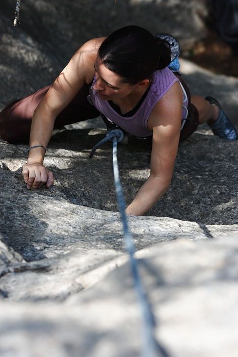 Beth Marek top rope climbing Hollywood (5.7), taken from the anchors of the route.  It was Beth's third time outside, and another long day of rock climbing at Seismic Wall on Austin's Barton Creek Greenbelt, Monday, May 25, 2009.

Filename: SRM_20090525_10394952.JPG
Aperture: f/5.6
Shutter Speed: 1/500
Body: Canon EOS-1D Mark II
Lens: Canon EF 80-200mm f/2.8 L