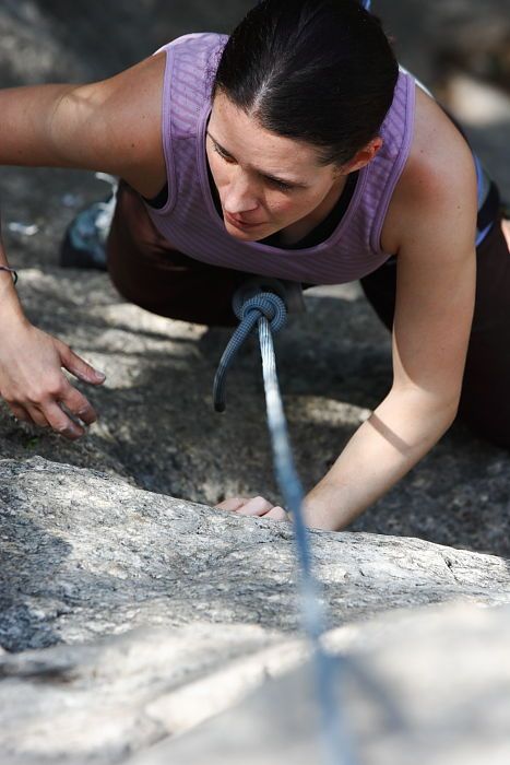 Beth Marek top rope climbing Hollywood (5.7), taken from the anchors of the route.  It was Beth's third time outside, and another long day of rock climbing at Seismic Wall on Austin's Barton Creek Greenbelt, Monday, May 25, 2009.

Filename: SRM_20090525_10400058.JPG
Aperture: f/5.6
Shutter Speed: 1/400
Body: Canon EOS-1D Mark II
Lens: Canon EF 80-200mm f/2.8 L