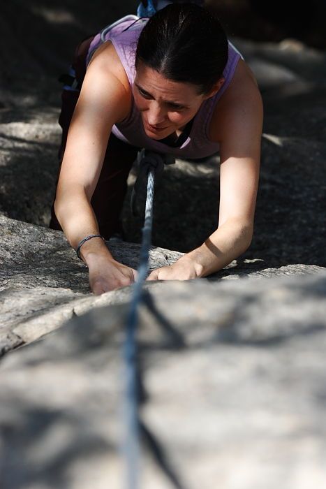 Beth Marek top rope climbing Hollywood (5.7), taken from the anchors of the route.  It was Beth's third time outside, and another long day of rock climbing at Seismic Wall on Austin's Barton Creek Greenbelt, Monday, May 25, 2009.

Filename: SRM_20090525_10400561.JPG
Aperture: f/5.6
Shutter Speed: 1/1000
Body: Canon EOS-1D Mark II
Lens: Canon EF 80-200mm f/2.8 L