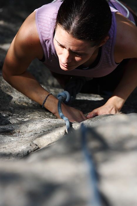 Beth Marek top rope climbing Hollywood (5.7), taken from the anchors of the route.  It was Beth's third time outside, and another long day of rock climbing at Seismic Wall on Austin's Barton Creek Greenbelt, Monday, May 25, 2009.

Filename: SRM_20090525_10400866.JPG
Aperture: f/5.6
Shutter Speed: 1/1250
Body: Canon EOS-1D Mark II
Lens: Canon EF 80-200mm f/2.8 L