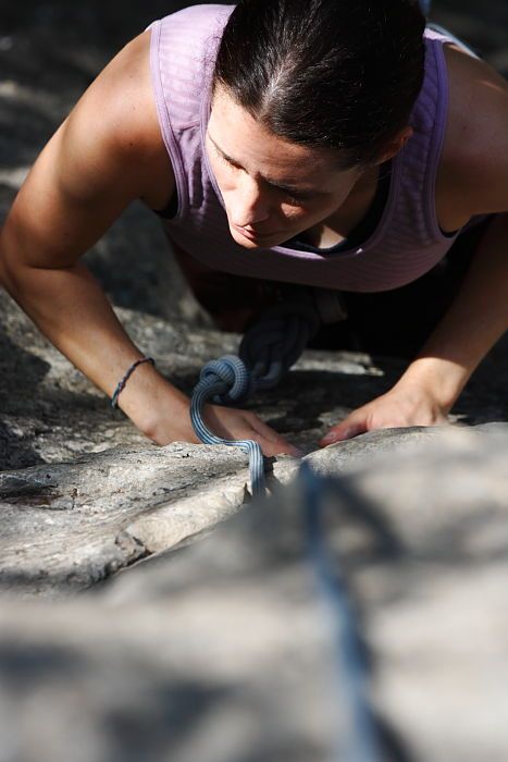 Beth Marek top rope climbing Hollywood (5.7), taken from the anchors of the route.  It was Beth's third time outside, and another long day of rock climbing at Seismic Wall on Austin's Barton Creek Greenbelt, Monday, May 25, 2009.

Filename: SRM_20090525_10400867.JPG
Aperture: f/5.6
Shutter Speed: 1/1000
Body: Canon EOS-1D Mark II
Lens: Canon EF 80-200mm f/2.8 L