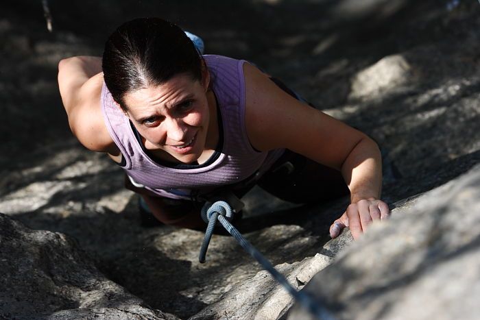 Beth Marek top rope climbing Hollywood (5.7), taken from the anchors of the route.  It was Beth's third time outside, and another long day of rock climbing at Seismic Wall on Austin's Barton Creek Greenbelt, Monday, May 25, 2009.

Filename: SRM_20090525_10402874.JPG
Aperture: f/5.6
Shutter Speed: 1/1250
Body: Canon EOS-1D Mark II
Lens: Canon EF 80-200mm f/2.8 L