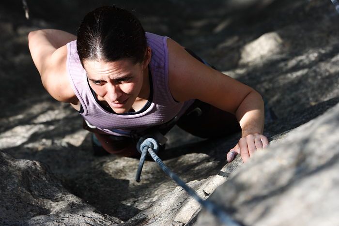 Beth Marek top rope climbing Hollywood (5.7), taken from the anchors of the route.  It was Beth's third time outside, and another long day of rock climbing at Seismic Wall on Austin's Barton Creek Greenbelt, Monday, May 25, 2009.

Filename: SRM_20090525_10402875.JPG
Aperture: f/5.6
Shutter Speed: 1/1000
Body: Canon EOS-1D Mark II
Lens: Canon EF 80-200mm f/2.8 L