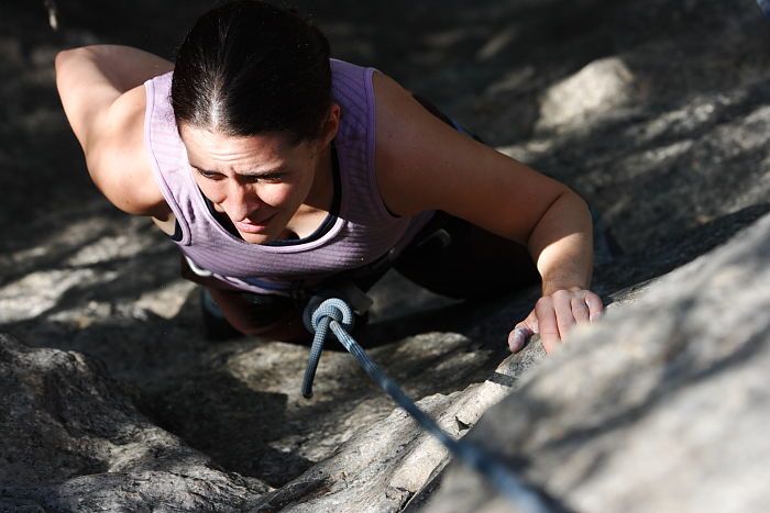 Beth Marek top rope climbing Hollywood (5.7), taken from the anchors of the route.  It was Beth's third time outside, and another long day of rock climbing at Seismic Wall on Austin's Barton Creek Greenbelt, Monday, May 25, 2009.

Filename: SRM_20090525_10402976.JPG
Aperture: f/5.6
Shutter Speed: 1/1000
Body: Canon EOS-1D Mark II
Lens: Canon EF 80-200mm f/2.8 L