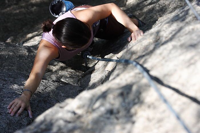 Beth Marek top rope climbing Hollywood (5.7), taken from the anchors of the route.  It was Beth's third time outside, and another long day of rock climbing at Seismic Wall on Austin's Barton Creek Greenbelt, Monday, May 25, 2009.

Filename: SRM_20090525_10404683.JPG
Aperture: f/5.6
Shutter Speed: 1/1000
Body: Canon EOS-1D Mark II
Lens: Canon EF 80-200mm f/2.8 L